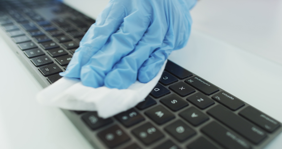 Corona virus cleaning and disinfection of your workspace. Disinfecting wipes to wipe surface of desk, keyboard, mouse at home office or doctor hospital office. Stop the spread of coronavirus COVID-19. | Shutterstock HD Video #1048950259