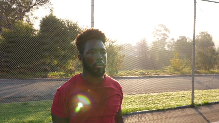African American man working out by doing jumping jacks