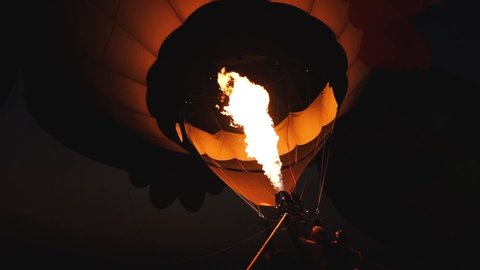 Fire from burner inflated hot air balloon. Fire bursts. Flame tongue.	
