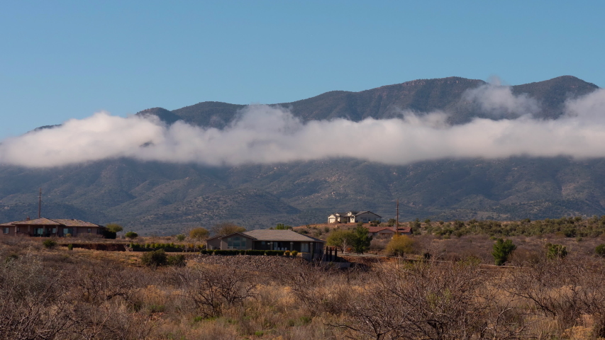 Scenic Churning Clouds Below Mountain Timelapse