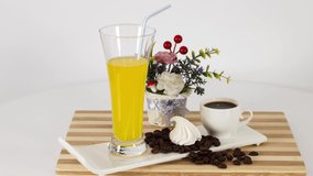 White mug with black coffee with sweets on table background. *UHD.