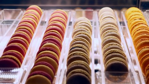Sets of Colorful Sweet French Macaron Cakes in Row on the Cafe Display. Desserts from Almond Dough in the Pastry. Macaroon Dessert In Bakery Shop