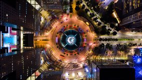 4K Hyperlapse time-lapse of car traffic transport at roundabout fountain of wealth in Singapore, drone aerial top view, fly upward. Transportation technology, city life, Asia travel landmark concept - Powered by Shutterstock - Get 15% off with code: PIKWIZARD15