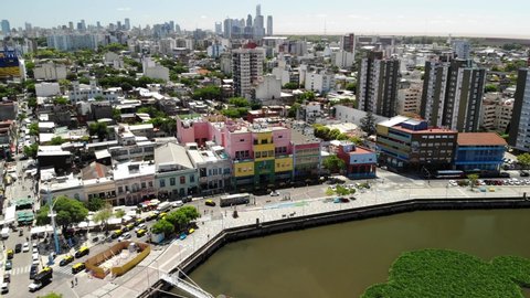 Aerial view of Benito Quinquela Martín museum, located in La Boca neighborhood in Buenos Aires. Drone flying over Matanzas river and slowly descending