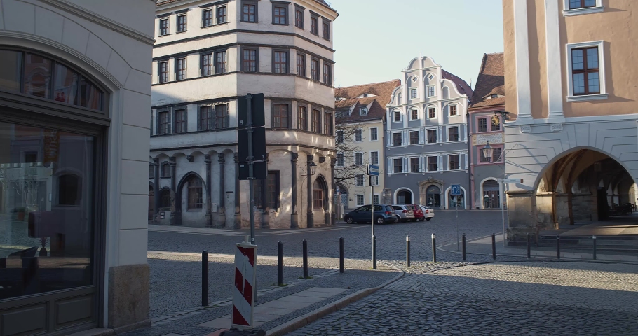 A view across the Untermarkt in the german city Goerlitz. Wes Anderson shot The Grand Budapest Hotel in Goerlitz. The streets are empty due to safety regulations during the corona crisis. 4K-Clip. | Shutterstock HD Video #1048974460