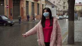 Woman try to stop taxi because of problem with traffic at bus station during covid 19 virus pandemic - Powered by Shutterstock - Get 15% off with code: PIKWIZARD15