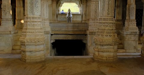 Columns of beautiful Ranakpur Jain temple or Chaturmukha Dharana Vihara. Marble ancient medieval carved sculpture carvings of sacred religious place of jainism worship. Ranakpur, Rajasthan. India