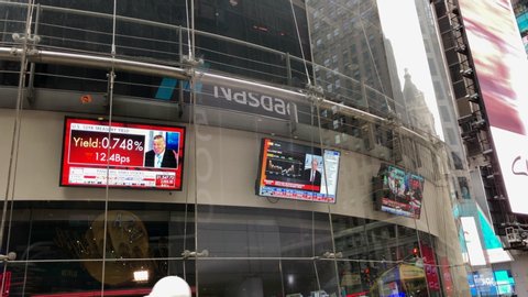 New York, New York / United States - March 17 2020: Stocks crash do to coronavirus outbreak. COVID-19. News of market crash on TV's at the Nasdaq Stock Exchange.