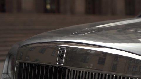 Moscow, Russia - 13 03 2020: close up Rolls-Royce Cullinan logo or sign lift up from hood.