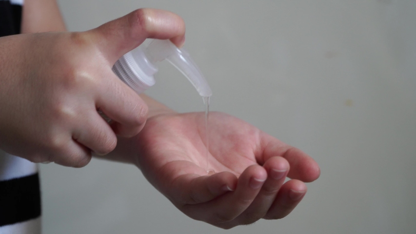 The child presses the antiseptic bottle COVID-19, a Healthcare Video by Rito Succeed
