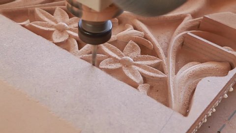 Traditional pattern wood carving with machine.