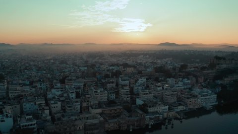 Ariel view of Udaipur city, sunrise at lake Pichola in Udaipur(City of lakes) Rajasthan India, 4k Drone shot.