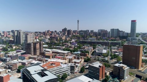 An aerial view of the Johannesburg skyline as seen from above the Maboneng district on a bright sunny day. 