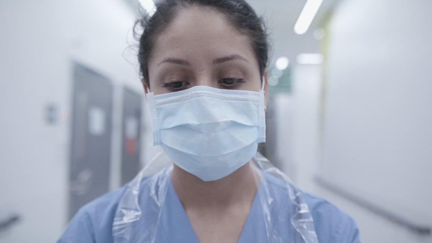 Swedish nurse with mask during the Coronavirus pandemic. Close up in slow motion. Royalty-Free Stock Footage #1049010778