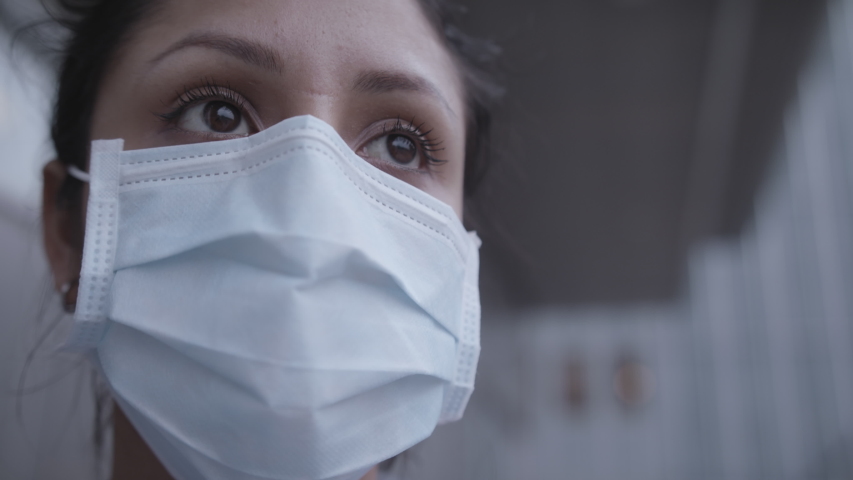 Closeup of nurse with mask outside infection room Royalty-Free Stock Footage #1049010799