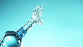Super slow motion of splashing water from bottle. Filmed on very high speed camera, 1000 fps. - Powered by Shutterstock - Get 15% off with code: PIKWIZARD15