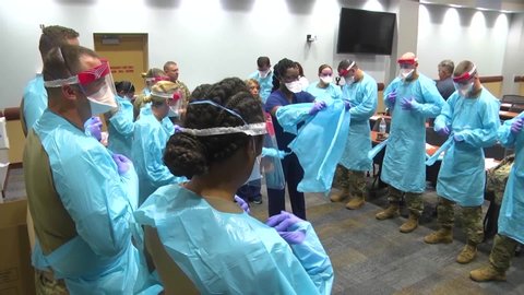 CIRCA 2020 - Surgical masks and gowns and other protective medical supplies are tested by the National Guard during Covid-19 coronavirus outbreak.