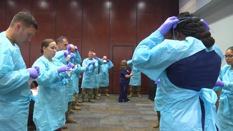 CIRCA 2020 - Surgical masks and gowns and other protective medical supplies are tested by the National Guard during Covid-19 coronavirus outbreak.