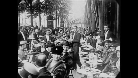 CIRCA 1927- Patrons are waited on outdoors at the Cafe de la Paix in Paris, France.