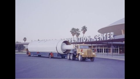 CIRCA 1962 - The XPGM-17A Thor, ALGM-25C Titan II, and XLGM-30A Minuteman are towed past the Las Vegas Convention Center.