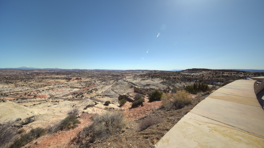 A completely clear day looking out across the Escalante Canyons from the Head of the Rocks Overlook visible in foreground