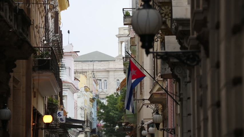 Cuban Flag Hanging In Quiet Old Havana Alley