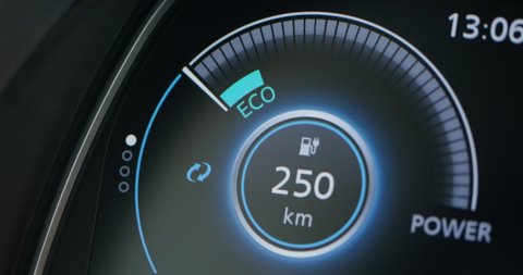 Electric car dashboard display closeup. Electric Car Concept. Battery indicator showing an increasing battery charge. The battery indicator shows it fills up to 100. Electric Car Battery Gauge