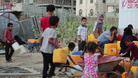 Taiz _ Yemen - 2 June 2020 : Poor children fetch water due to the water crisis and the difficult living conditions of the residents of Taiz, Yemen