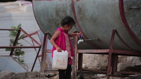 Taiz Yemen - 18 Mar 2019:  A Yemeni girl searches for water in the city of Taiz, which is under war and besieged by the Houthi militia