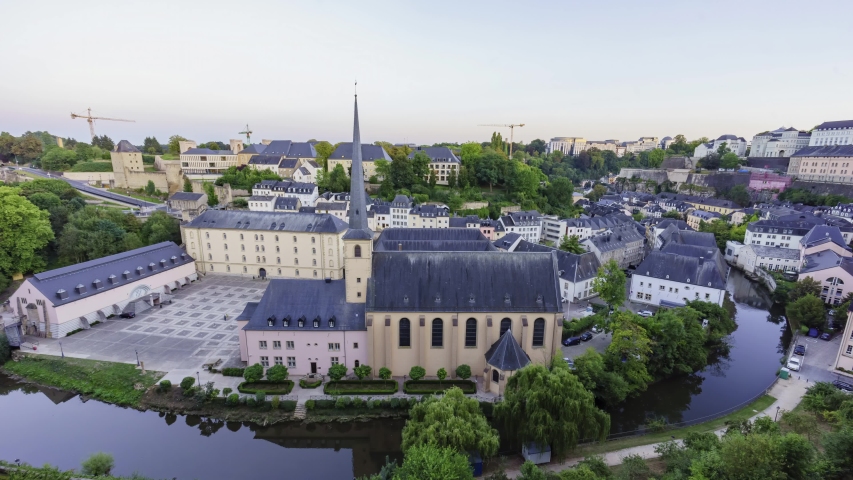 Afternoon to night high angle time lapse of the cityscape with Neumunster Abbey at Luxembourg