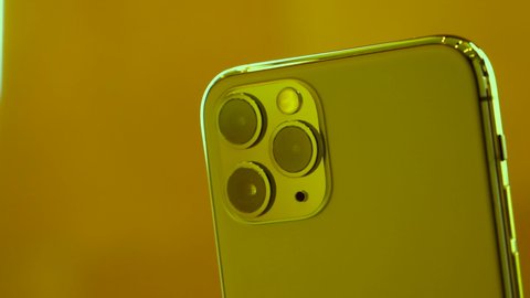 Paris, France - Sep 20, 2019: Close-up of the rear view of the new green iPhone 11 Pro Pro Max with triple-camera in Apple Store on the day smartphone by Apple Computers goes on sale
