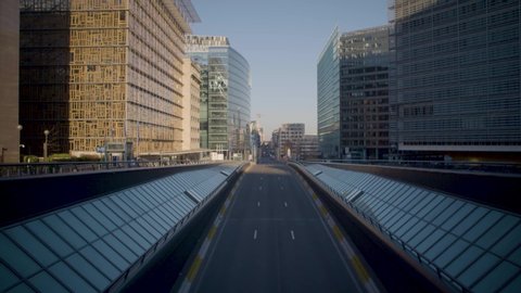 BELGIUM/BRUSSELS: smooth tilt up slow motion of the empty street in the European District due to the coronavirus. This is at the Schuman Roundabout 4K
