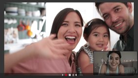 Family Using Video Conference for video call at home with teenage daughter abroad