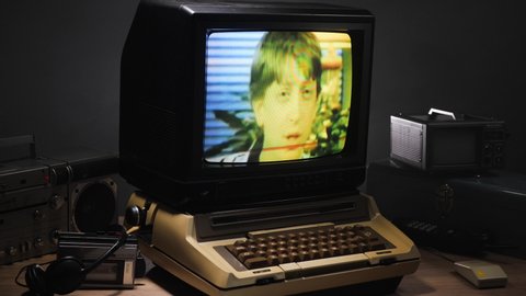 Bill Gates interview on a vintage old computer CRT monitor from the 1970 1980 1990. Old tech being displayed on the desk around the device. MONTREAL - CANADA - MARCH 2020