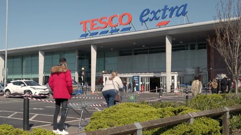 BIRMINGHAM, UK - 2020: Tesco supermarket queue during social distancing measures in cover-19 pandemic