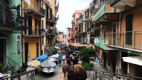 Italy Tuscany Cinque Terre 22 JUNE 2018: Walking through the street of Cinque Terre town with lots of tourists. Camera with stabiliser.