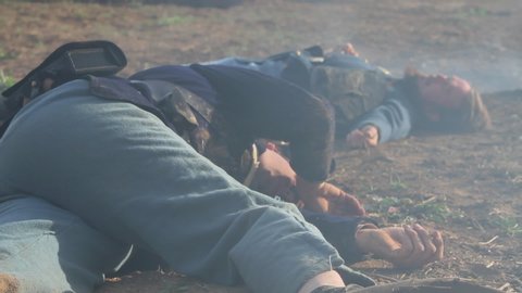 PETERSBURG, VIRGINIA - MARCH 2018 -  Civil War reenactment -- aftermath of battle.  Dead, wounded and dying soldiers scattered across broken battlefield. Union and Confederate Casualties.