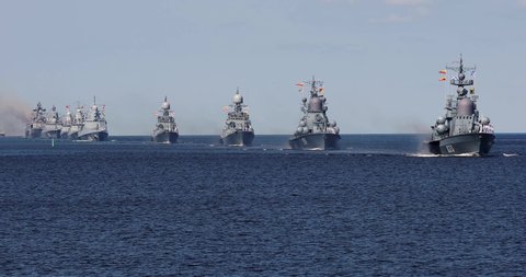 A line ahead of modern russian military naval battleships warships in the row, northern fleet and baltic sea fleet, summer sunny day, 4k footage video 
