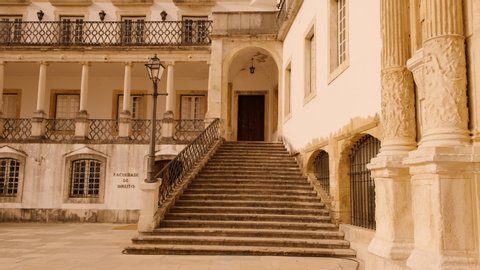 Climbing the stairway of the Faculty of Law in the Old University of Coimbra, Portugal, one of the oldest in the world, dating back to 1290