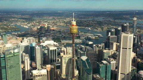 SYDNEY, AUSTRALIA – MARCH 20, 2020: Panoramic aerial view of Sydney city and Sydney Harbour on a sunny morning in Sydney, Australia  
