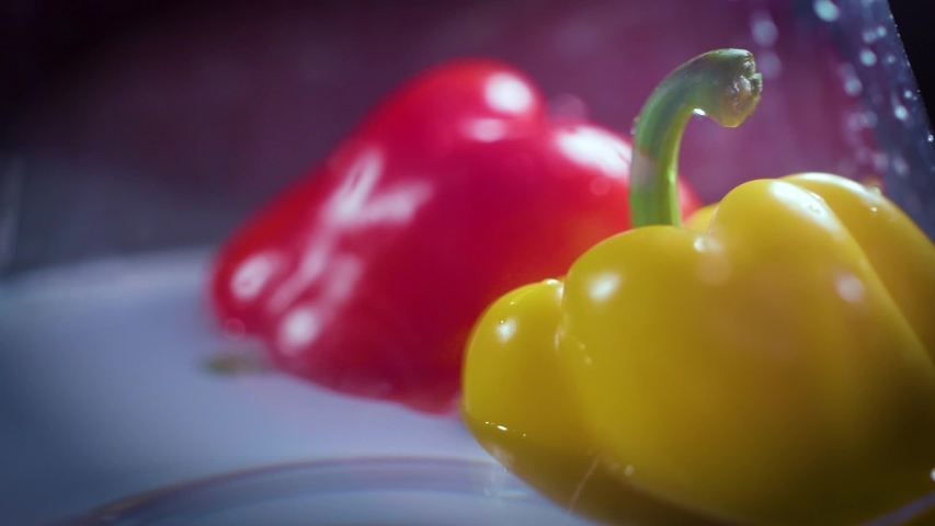 trio of bell peppers in the rich, bold hues of red, yellow, and green. Beautifully arranged to display their glossy, smooth exteriors and the dynamic color  Royalty-Free Stock Footage #1049133127