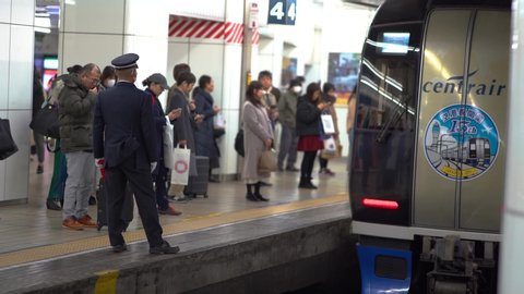 Nagoya, Japan - Feb. 1, 2020: Unidentified commuters are seen waiting in Centrair Chubu airport line at Nagoya Train Station. The Covid-19 just spread in Japan at this time.