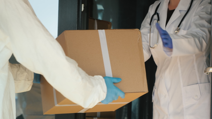Boxes with medical goods unloaded on the doorstep of the hospital | Shutterstock HD Video #1049158786