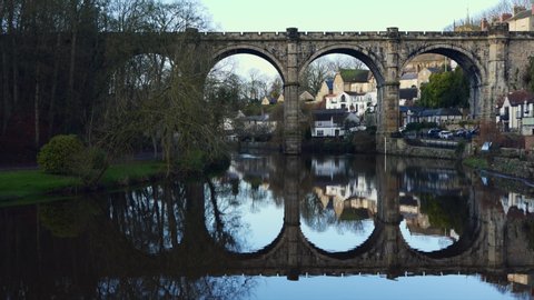 The view overlooking Knaresborough Bridge showing the reflection in the River Nidd