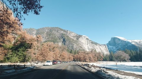 YOSEMITE VALLEY, USA - DECEMBER 9, 2019: Driving Car in Yosemite Valley. Half Dome. California USA.