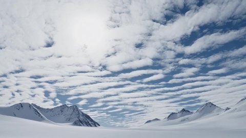 Timelapse of impressive clouds beyond ice, snow and mountain surface in Antarctica, Vinson massiv, South Pole