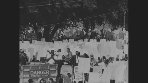 CIRCA 1963 - crowds of civil rights activists carrying signs from the Washington Monument to the Lincoln Memorial during the March on Washington.
