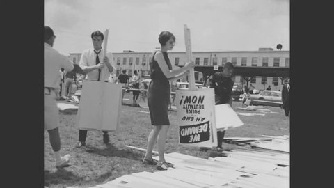 CIRCA 1963 - Signs are painted and structures are built and a microphone test is shown as civil rights activists prepare for the March on Washington.