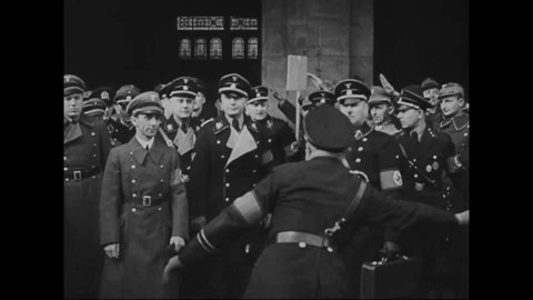 CIRCA 1935 - Joseph Goebbels salutes Nazis stationed in the Free City of Danzig in time for the elections, and his car drives past more.