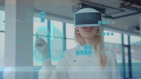 Augmented Reality. Close-up of a Female Doctor Looking: Medical Charts, 3D Hologram (DNA hologram, Pulmonary System, Muscular System, COVID-19) Wearing VR Glasses and Headsets. Future Medicine. VR - Powered by Shutterstock - Get 15% off with code: PIKWIZARD15